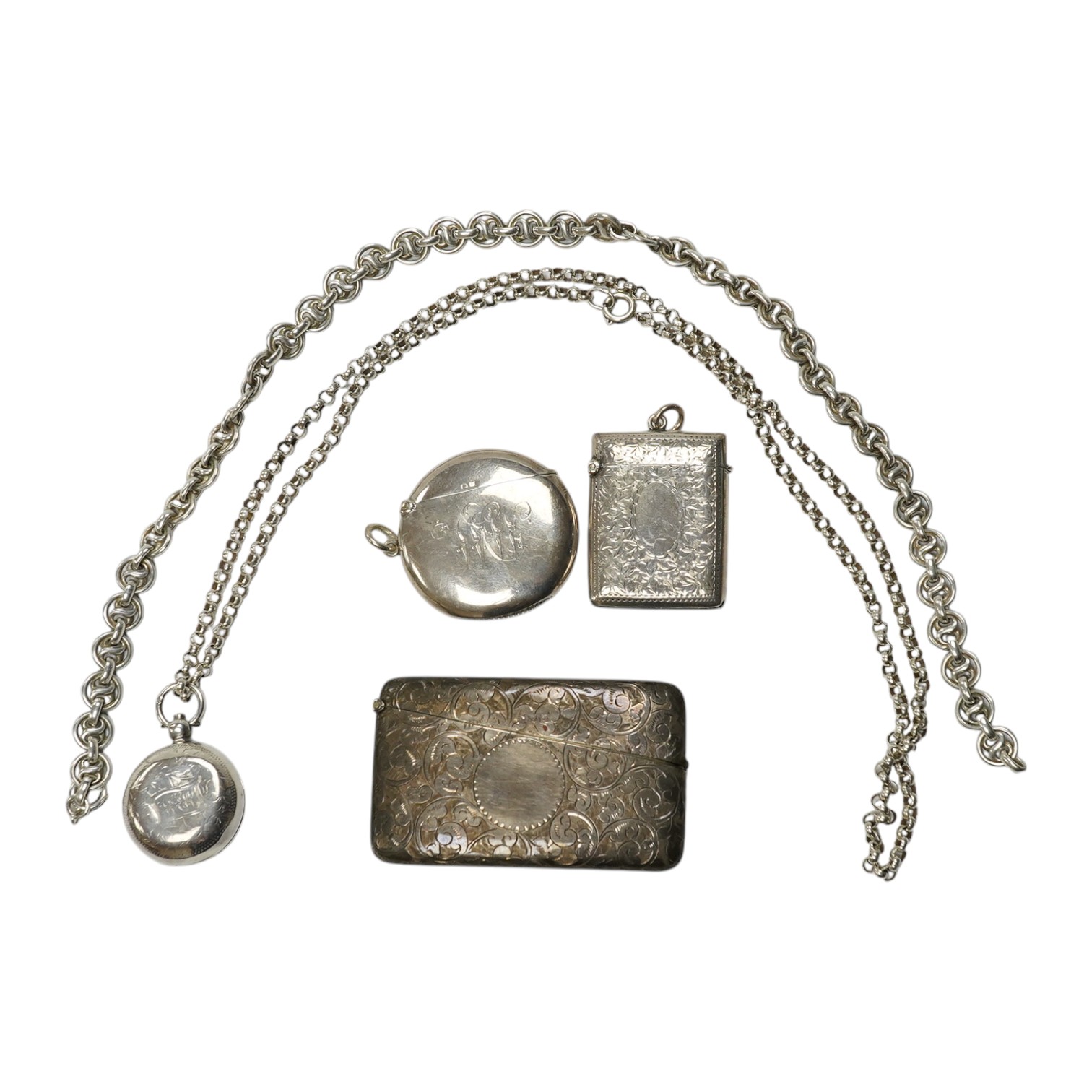 An Edwardian engraved silver sovereign case, Birmingham, 1905, on a silver chain, one other sterling chain, two silver vesta cases and a silver card case. Condition - poor to fair